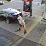 a person on roller skates at a gas station